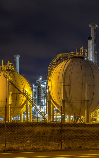 Spherical LNG storage tanks at nighttime