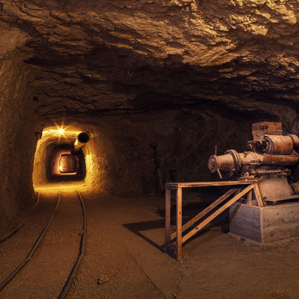 A dark image of the inside of a mine shaft.