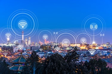 Cityscape illustrating connected devices through the Internet of Things