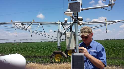 Paul Tipling, Regional Sales Manager for McCrometer, installs a weather station for an agriculture customer in the Midwest
