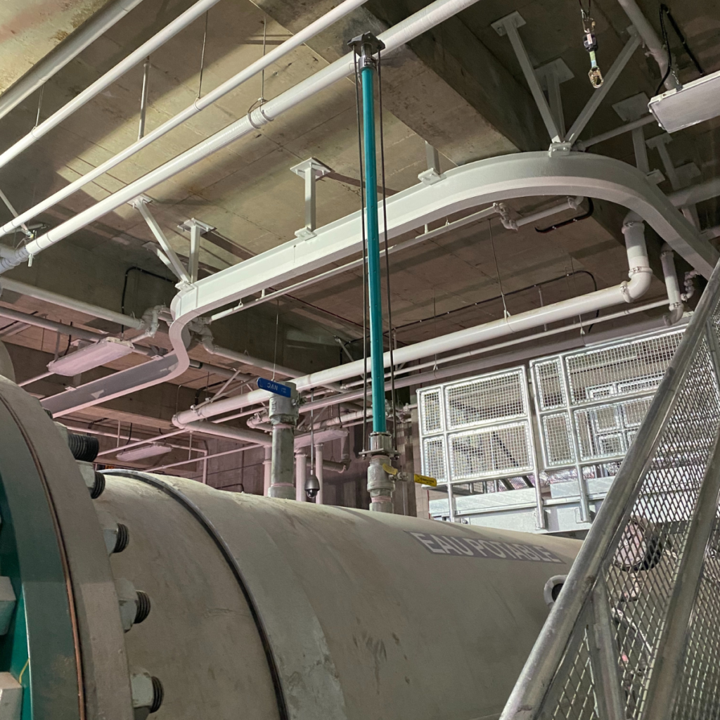McCrometer’s FPI Mag installed in a pipe with beige piping in the background. 